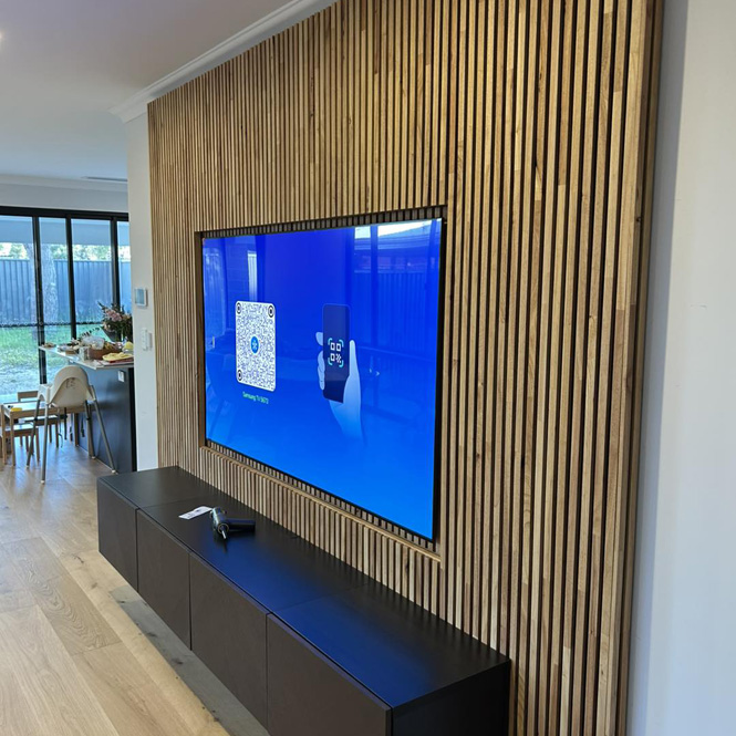 Timber batten feature wall around a wall-mounted TV